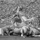 Dewey Selmon flies over the pile to stop the running back. Photo credit: AP